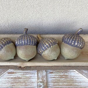 resin acorn table decor with green patina finish and brown with antique gold top with stem for fall table decor or mantel decor. Thanksgiving table decor. artificial acorn fall resin acorns pairs well with mushrooms. Fall basket filler wood bowl