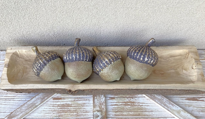 resin acorn table decor with green patina finish and brown with antique gold top with stem for fall table decor or mantel decor. Thanksgiving table decor. artificial acorn fall resin acorns pairs well with mushrooms. Fall basket filler wood bowl