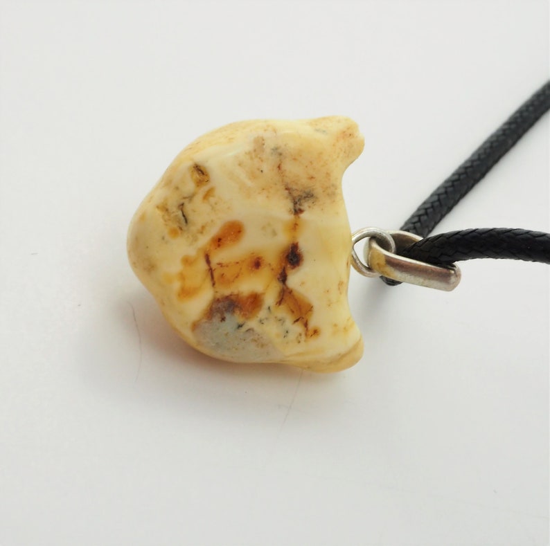 Unique Artisan butterscotch amber carved cat face pendant black chord necklace