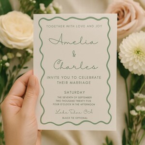 May include: Wedding invitation with a sage green border and text. The invitation reads "Amelia & Charles" and invites guests to celebrate their marriage on Saturday, September 7, 2025, at four o'clock in the afternoon in Lake Tahoe, CA. Black tie optional.