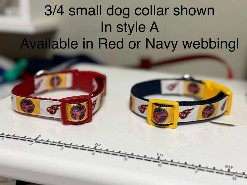May include: Two small dog collars in style A. One is red with a red buckle, the other is navy blue with a yellow buckle. Both collars have a white and yellow patterned ribbon with a logo and the text "F". The text in the image says "3/4 small dog collar shown In style A Available in Red or Navy webbing!"
