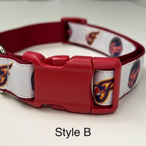May include: Red and white dog collar with a red plastic buckle and a silver metal D-ring. The white ribbon features a repeating pattern of a team logo. The text "Style B" is at the bottom.