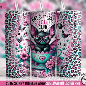 May include: A 20 ounce skinny tumbler wrap sublimation design featuring a pink and blue leopard print background with a cartoon bat character wearing sunglasses and a teal teacup. The text "Bat Sh*t Crazy Social Club" is written in a pink and black font.