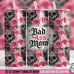 May include: A 20 oz skinny tumbler wrap with a design featuring skulls, pink roses, and the text "Bad Ass Mom." The design includes a pink and gray color scheme, with a seamless pattern of skulls and flowers.