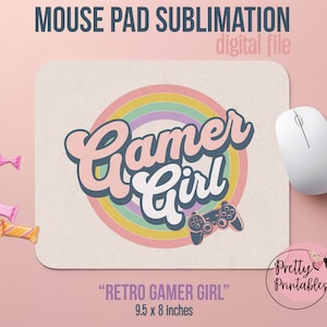 May include: A sublimation design for a mouse pad featuring a retro-style rainbow graphic with the text "Gamer Girl" in pink and blue lettering. A black and white gamepad is in the center of the design. The text "Retro Gamer Girl" and the dimensions "9.5 x 8 inches" are below the design.