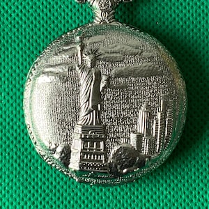 Quartz full hunter Pocket / fob watch in working order with statue of liberty Embossed design
