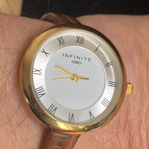 Infinite Ladies Fashion Watch With Silver and White Dial