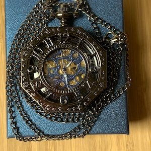 8 Sided Strada Half Hunter style Mechanical pocket watch, Black Tone pierced  Detailing Skeleton dial with Blue Highlights and numbers Case