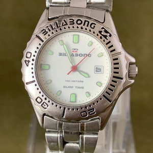 Vintage Ladies Billabong wristwatch with the date at the 3 and a red second hand Surf Time