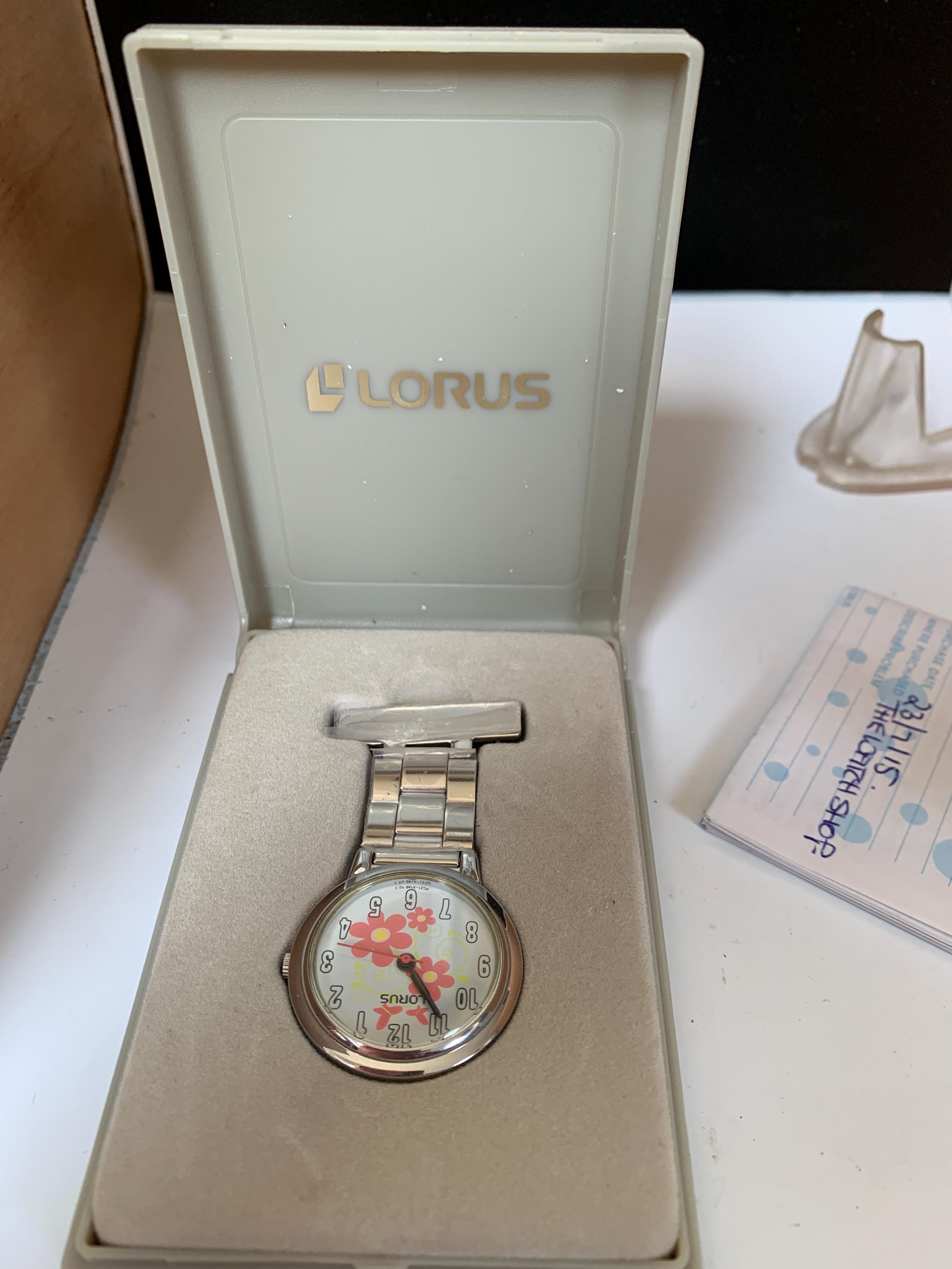 Vintage Lorus Silver Lumibrite Glow in the Dark Calendar Watch Lorus Lumibrite] Value Champ! : r/Watches main image 2