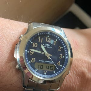 May include: A rustic wooden sign with the text "Welcome to our home" in white lettering. The sign features a distressed finish and a simple, inviting design, perfect for front door decor.