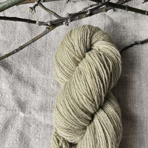 Natural plant dyed yarn/ hand dyed wool yarn. FINGERING sock baby weight yarn in pale green. Suitable for knitting tablet weaving.