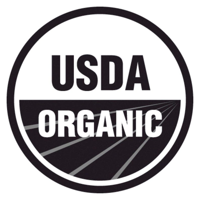 May include: A black and white USDA Organic seal with the text "USDA ORGANIC" in white letters.