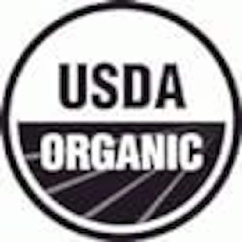 May include: USDA Organic seal, a black and white logo with the text "USDA ORGANIC" and a stylized image of rows of farmland.