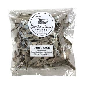 May include: A clear plastic bag filled with dried white sage leaves. The bag has a label that reads "Smoke Camp Crafts" and "White Sage Salvia apiana Use as incense for purification. Net wt. ½ oz (14g)"