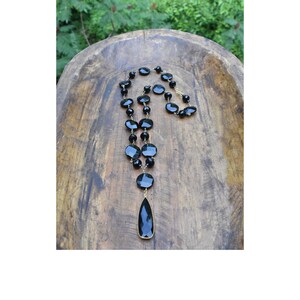 Faceted Onyx Beads on a Wire Wrapped Chain with a Onyx Pear Shaped, Bezel Pendant