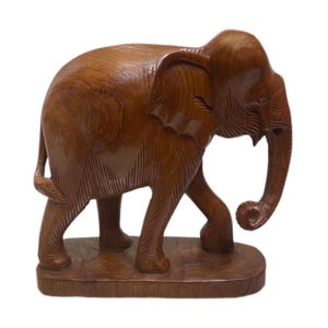 Large hand-carved wood elephant on platform, Vintage figurine