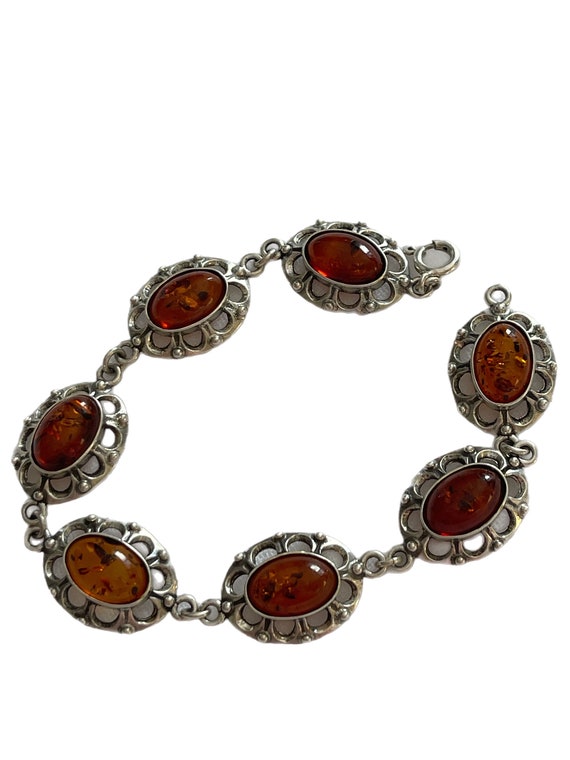 Sterling and ornate oval amber bracelet