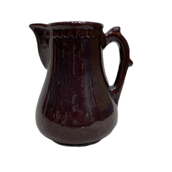 Antique brown crockery pitcher with metal tea insert