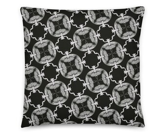 May include: Black and white throw pillow with a repeating geometric pattern of stylized butterflies.