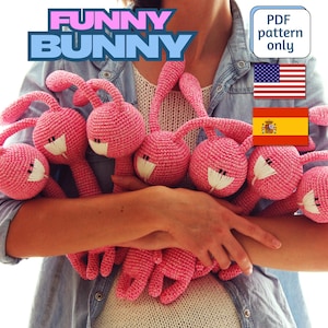 May include: A person holding a group of seven pink crocheted bunny toys. The toys have long ears and are all facing forward. The text "FUNNY BUNNY" is in the top left corner of the image. The text "PDF pattern only" is in the top right corner of the image. The image also includes the flags of the United States and Spain.