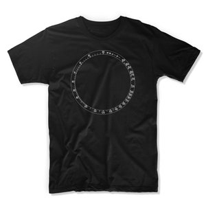 May include: Black t-shirt with a white circular design featuring a numbered scale from 5 to 300.
