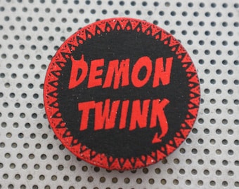 Demon Twink pin 1.5" pinback button. Handmade gay man queer typography badge LGBTQ print in metallic red foil on black Shiny flair for Pride