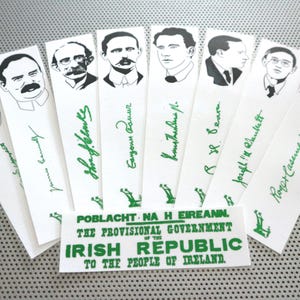May include: A set of eight black and white illustrations of men, each with a signature underneath. The illustrations are on white paper strips with green text that reads "Poblacht Na H Eireann. The Provisional Government of the Irish Republic to the People of Ireland."