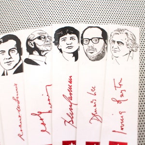 May include: A set of six black and white illustrations of people's faces with their names and signatures written in red ink below each illustration.