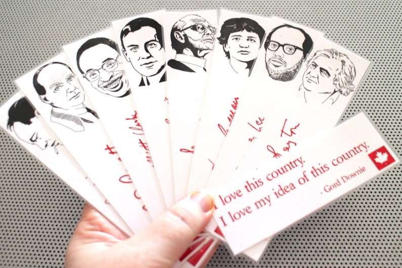 May include: A set of eight black and white bookmark illustrations of famous Canadian musicians. The bookmarks are printed on white paper with red text. The text on the bottom bookmark reads "I love this country. I love my idea of this country. - Gord Downie".