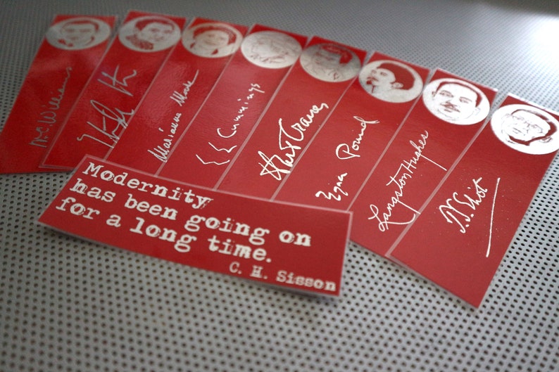 May include: Red bookmarks with white text and portraits. Each bookmark features a different name and signature. A rectangular card with the quote "Modernity has been going on for a long time" is also present.