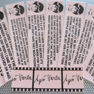 May include: A set of 10 pink and white bookmarks with black text and a black and white illustration of a person. The bookmarks feature quotes about filmmaking and the creative process. The text includes quotes such as "As soon as you begin a film, and the idea begins to germinate, you enter into what I'd call a state of grace in your active relationship to chance." and "I know I loved a film when I remember feeling good in the theater or feeling odd when I came out, either in tears or touched or mad."