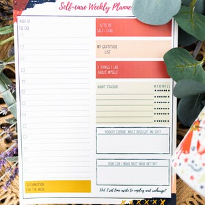 May include: A printable self-care weekly planner with sections for to-do lists, acts of self-care, a gratitude list, things you like about yourself, a habit tracker, a hooray corner, how to make next week better, and an affirmation for the week. The planner has a colorful abstract design.