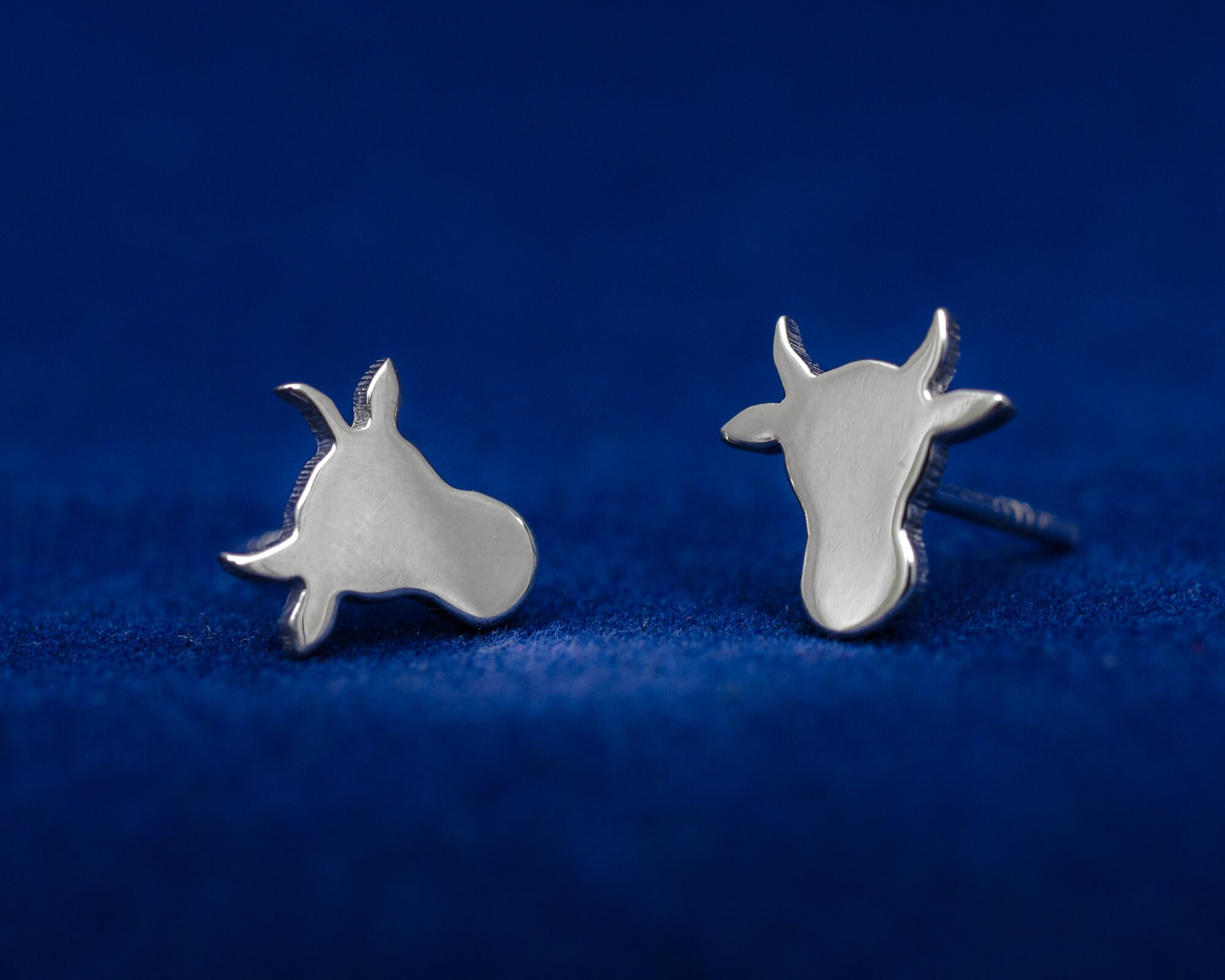 Cow head silhouette sterling silver stud earrings. Hand cut tiny cow studs. Cowgirl gift. Bull earrings. Silver bull studs. Cowboy gift.