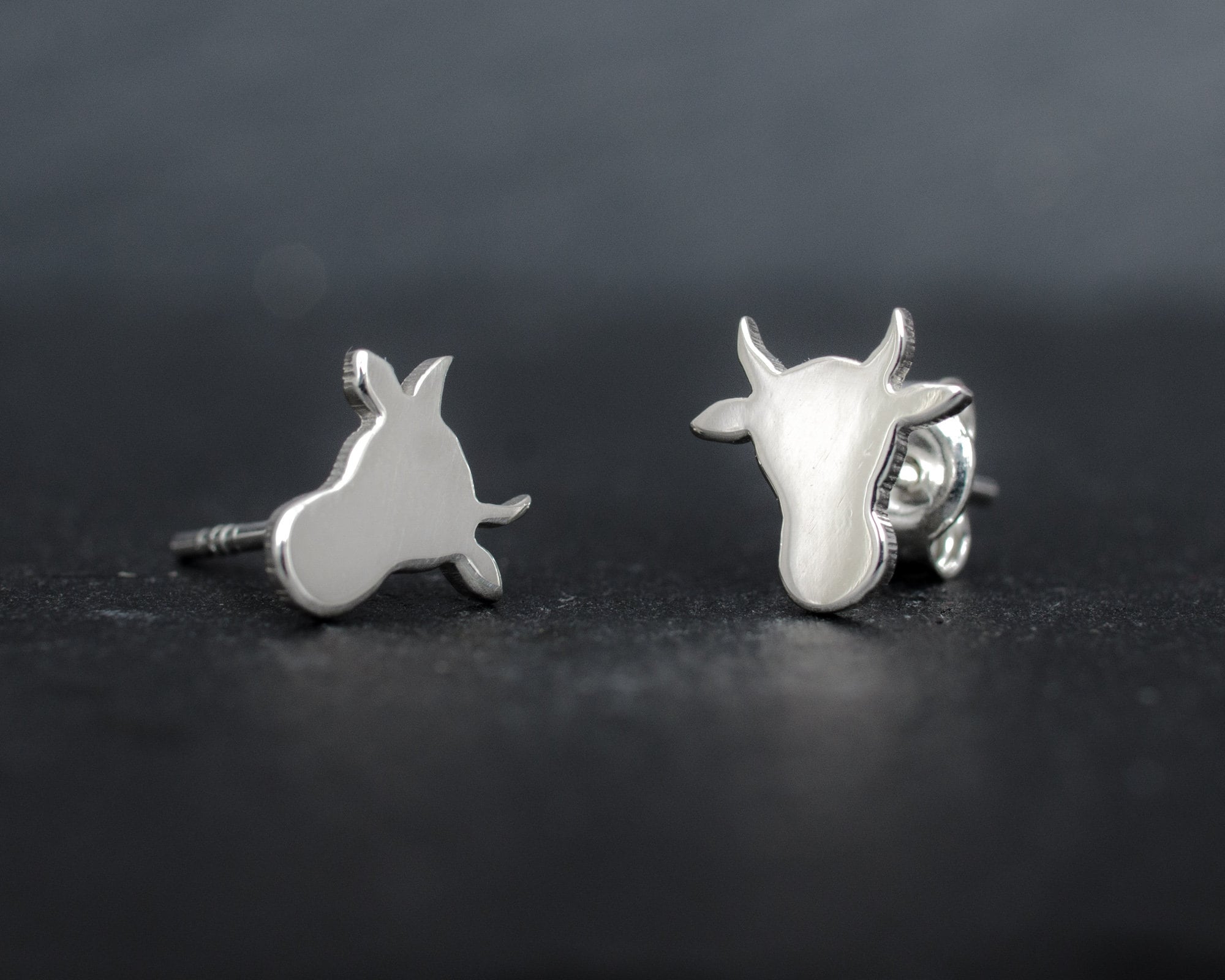 Cow head silhouette sterling silver stud earrings. Hand cut tiny cow studs. Cowgirl gift. Bull earrings. Silver bull studs. Cowboy gift.