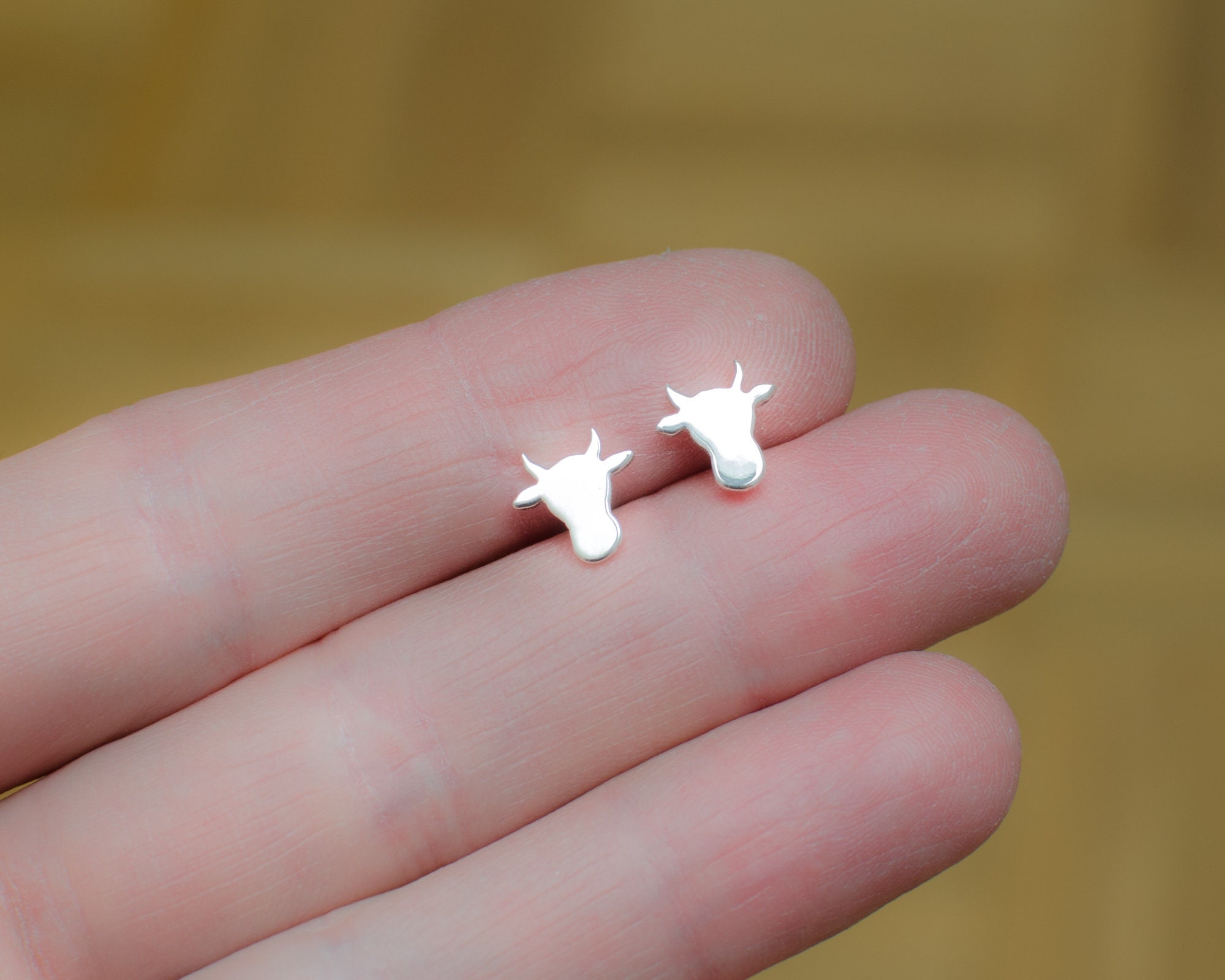Cow head silhouette sterling silver stud earrings. Hand cut tiny cow studs. Cowgirl gift. Bull earrings. Silver bull studs. Cowboy gift.