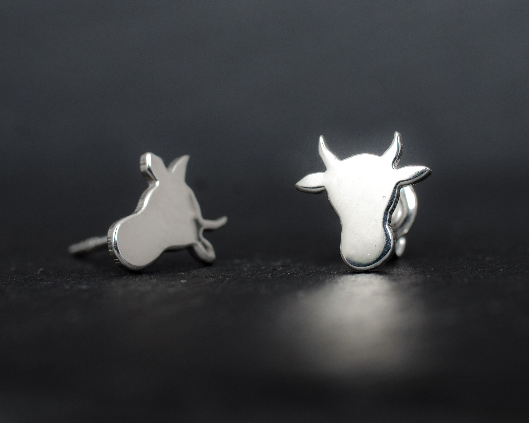 Cow head silhouette sterling silver stud earrings. Hand cut tiny cow studs. Cowgirl gift. Bull earrings. Silver bull studs. Cowboy gift.