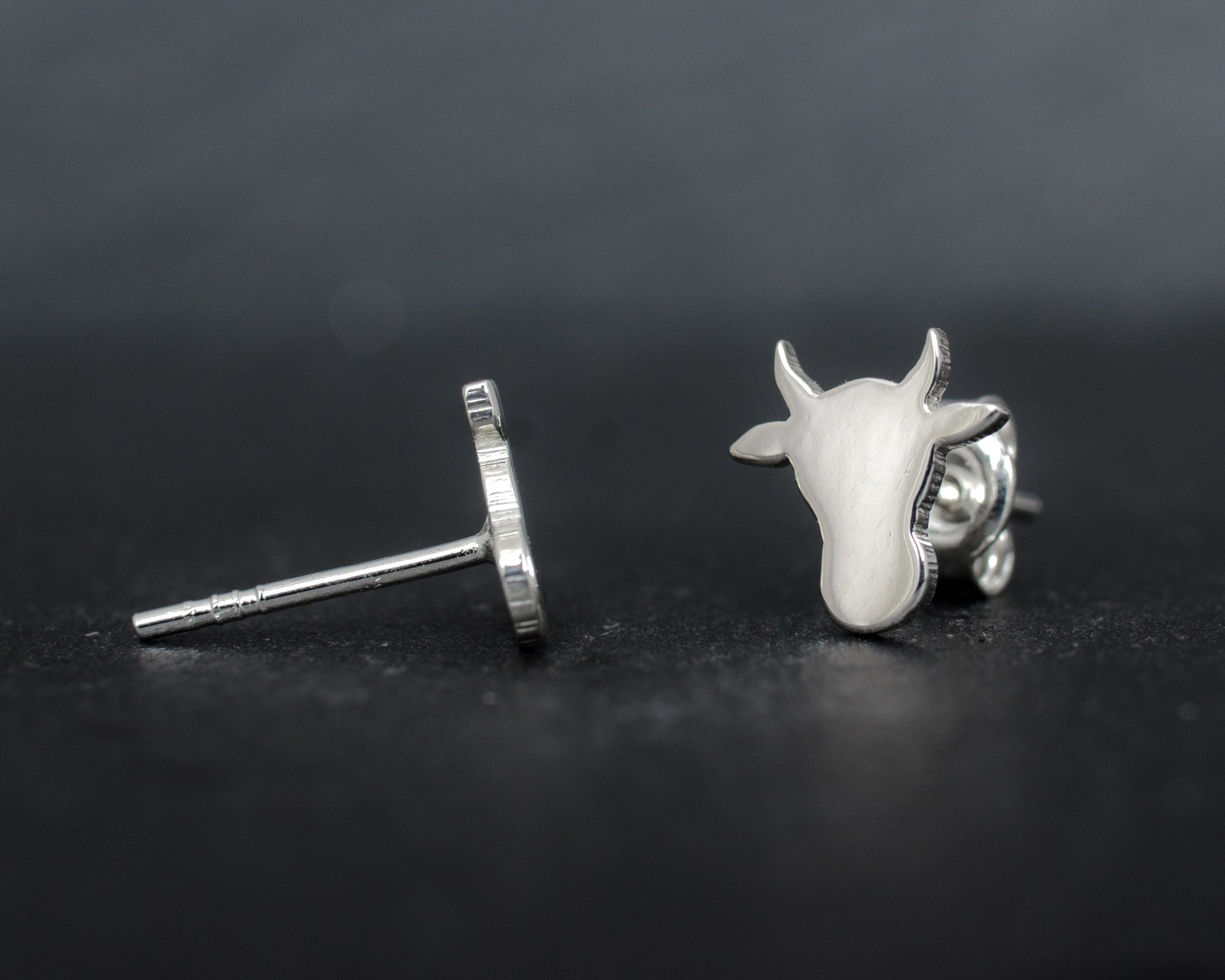 Cow head silhouette sterling silver stud earrings. Hand cut tiny cow studs. Cowgirl gift. Bull earrings. Silver bull studs. Cowboy gift.