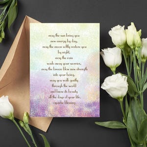 May include: A colorful card with a quote about finding strength and beauty in everyday life. The quote reads: "May the sun bring you new energy by day, may the moon softly restore you by night, may the rain wash away your worries, may the breeze blow new strength into your being, may you walk gently through the world and know its beauty all the days of your life. -apache blessing"