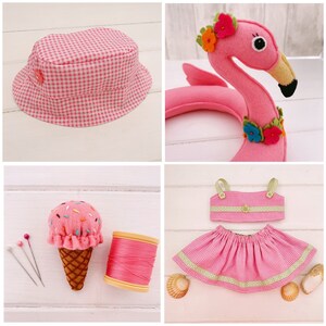 May include: A set of pink and green fabric crafts including a bucket hat, a flamingo pool float, a dress, and an ice cream cone pincushion.