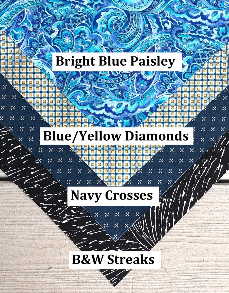 Pu&ograve; includere: Quattro campioni di tessuto disposti a forma di triangolo. Il campione superiore &egrave; un motivo paisley blu brillante. Il secondo campione &egrave; un motivo a rombi blu e gialli. Il terzo campione &egrave; un blu navy con croci bianche. Il campione inferiore &egrave; un motivo a strisce bianche e nere. Il testo "Bright Blue Paisley", "Blue/Yellow Diamonds", "Navy Crosses" e "B&W Streaks" &egrave; scritto sotto ogni campione.