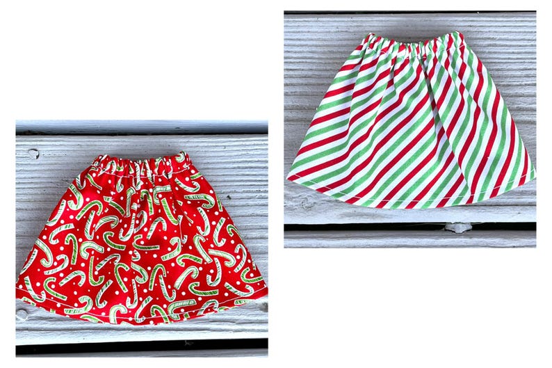Puede incluir: Dos faldas de Navidad rojas y verdes. Una falda tiene un patr&oacute;n de bast&oacute;n de caramelo y la otra tiene rayas rojas y verdes.