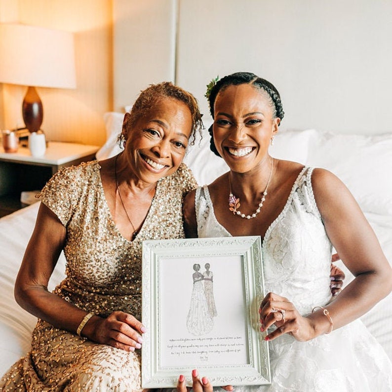 Custom illustration wedding drawing of mother of the bride and daughter in a back-facing style created with markers. This gift can be given on the wedding day morning or rehearsal dinner and includes a message from the bride or quote. Shown in frame.
