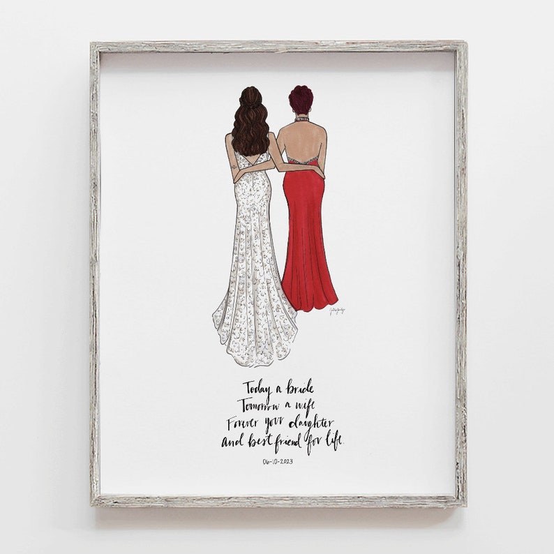 May include: A framed illustration of two women in wedding attire. The woman on the left is wearing a white lace dress and the woman on the right is wearing a red dress. The text below the illustration reads: "Today a bride, Tomorrow a wife, Forever your daughter and best friend for life, 06-10-2013."