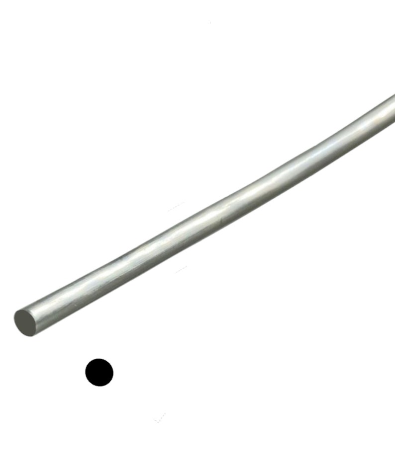 May include: A straight, silver-colored metal rod, possibly steel or aluminum, is diagonally positioned against a white background. The rod has a cylindrical shape and a smooth surface. A small, solid black circle is near the rod.