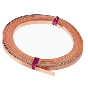 May include: A roll of copper sheet metal, wrapped in a pink ribbon, is ready for crafting projects.