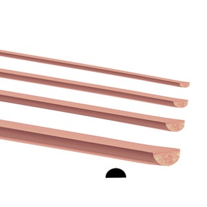 May include: Four wooden trim pieces with rounded edges. The trim pieces are arranged in a staggered pattern, with the largest piece at the bottom and the smallest piece at the top. The trim pieces are a light pink color.