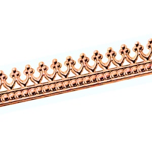 May include: A copper-colored trim with a decorative design featuring a repeating pattern of small rounded beads and a scalloped edge.