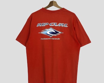 Camiseta naranja descolorida vintage de Rip Curl de los años 90, talla extragrande. Tablas de surf Rip Curl Australia. Camiseta de cuello redondo con logo grande. Talla XL.