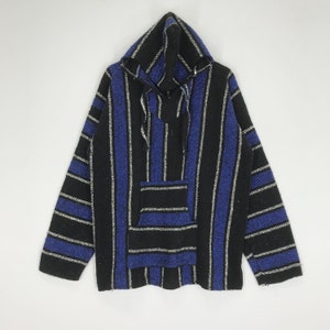 May include: A black and blue striped hooded poncho with a pocket on the front.